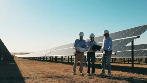 Team of three engineers working at solar... | Stock Video | Pond5