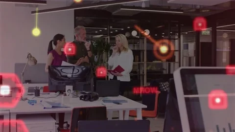 Team of three reviewing project by leaning and pointing monitor while red data Stock Footage 334036594
