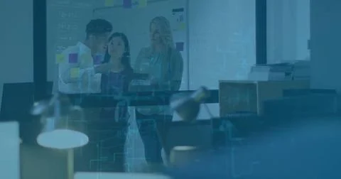 Team of three studying data projections in open plan office, with glass Stock Photos