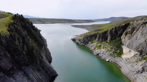 A team of tourists rowing on a SUP board along the river among the rocks Stock Footage 209798557