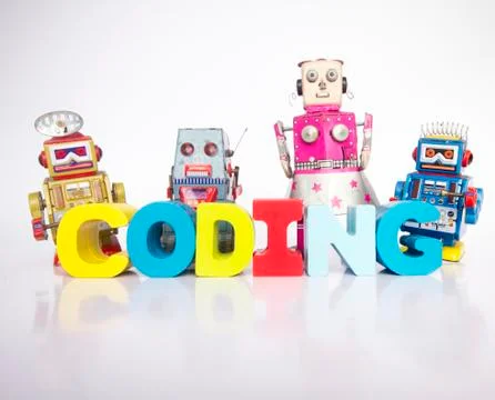 A team of toy robots with the word coding isolated Stockfoto's