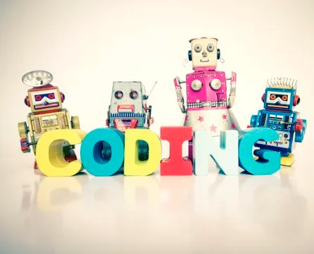 A team of toy robots with the word coding isolated Foto stock