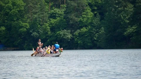 Team training coaching teaching workout for competition rowing dragon boat Stock Footage 248619868