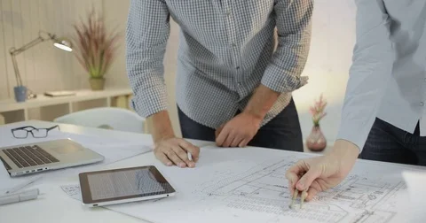 A team of two designers are working on the project Stock Footage 81577652