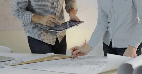 A team of two designers are working the project Stock Footage 81577988