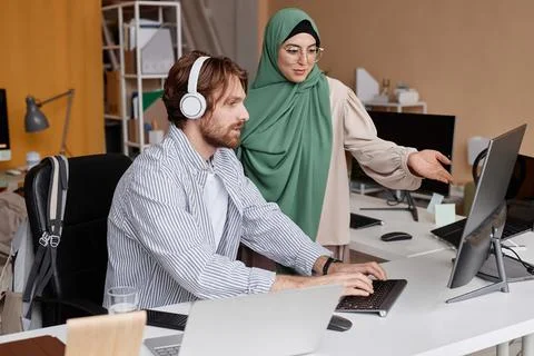 Team of Two IT Developers Discussing Project in Office 스톡 사진