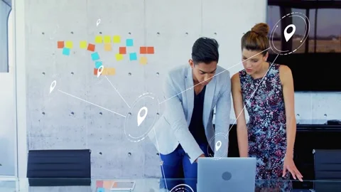 Team of two leaning over laptop, causing pins linking business notes to screen, Stock Footage 333169567