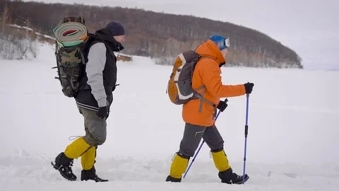 A team of two men go on an expedition. Difficult conditions of the north, each Video stock 106581947