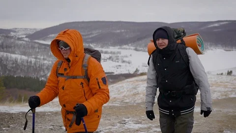 A team of two men go on an expedition. Difficult conditions of the north, each Stock Footage 106583079