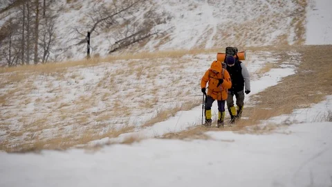 A team of two men go on an expedition. Difficult conditions of the north, each Stock-Footage 106583227