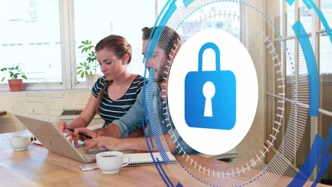 Team typing at laptop, data entry activating blue secure padlock overlaying pair Stock Footage 335317222