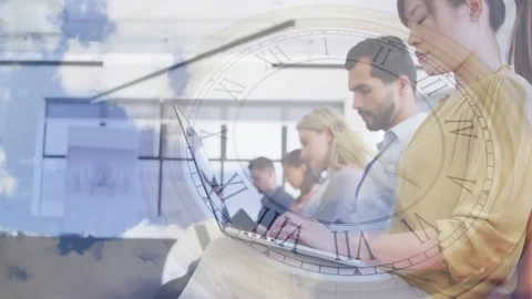 Team typing on laptops in meeting, camera panning, clock overlay tracking time Stock Footage 335651703