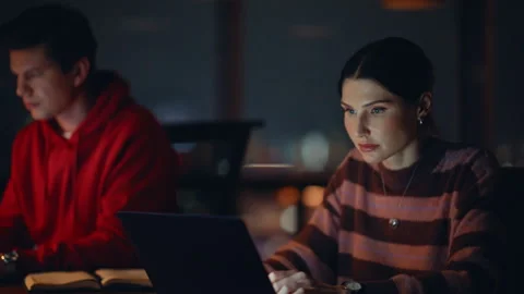 Team typing laptops night workspace closeup. Overtime managers working computers Stock Footage 340168011
