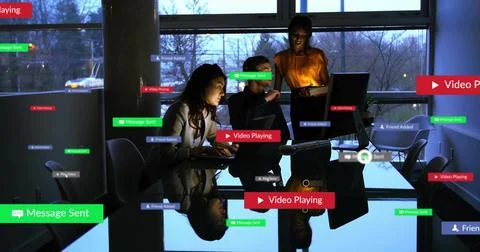 Team typing, tapping while badges popping up, piling over people, table, Stock Photos
