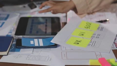 Team of UI UX web designer are working together to develop mobile responsiv.. Stock Footage 310534488