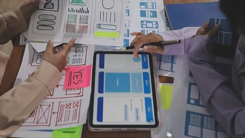 Team of UI UX web designer are working together to develop mobile responsiv.. Stock Footage 310534491
