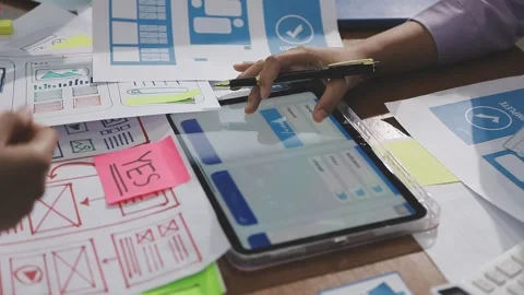 Team of UI UX web designer are working together to develop mobile responsiv.. Stock Footage 310534494