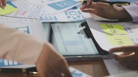 Team of UI UX web designer are working together to develop mobile responsiv.. Stock Footage 310534549