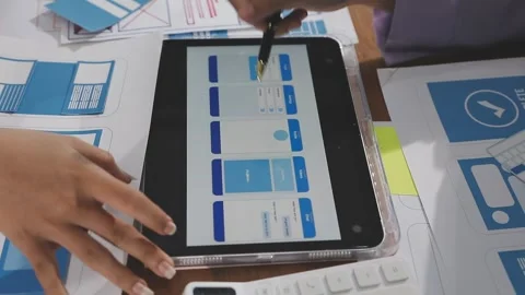 Team of UI UX web designer are working together to develop mobile responsiv.. Stock Footage 310534551