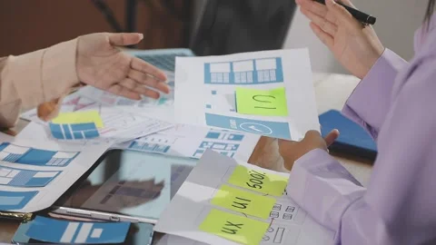 Team of UI UX web designer are working together to develop mobile responsiv.. Stock Footage 310534556