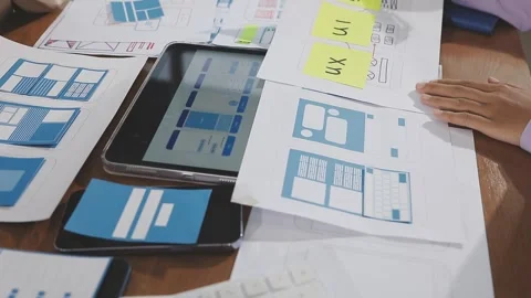 Team of UI UX web designer are working together to develop mobile responsiv.. Stock Footage 310534571