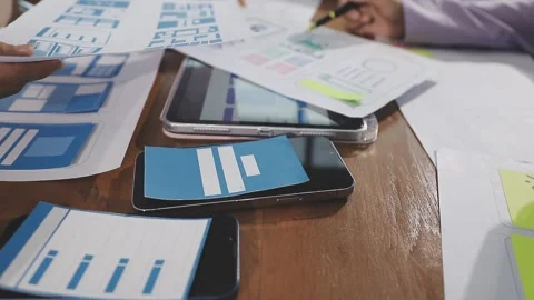 Team of UI UX web designer are working together to develop mobile responsiv.. Stock Footage 310534573