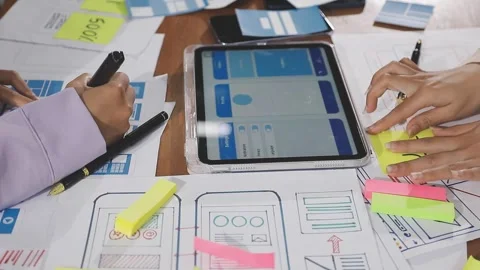 Team of UI UX web designer are working together to develop mobile responsiv.. Stock Footage 310534622
