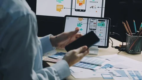 Team of UI UX web designer are working together to develop mobile responsiv.. Stock Footage 312243706