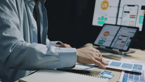 Team of UI UX web designer are working together to develop mobile responsiv.. Stock Footage 312243724