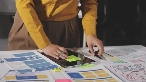 Team of UI UX web designer are working together to develop mobile responsiv.. Stock Footage 313584283