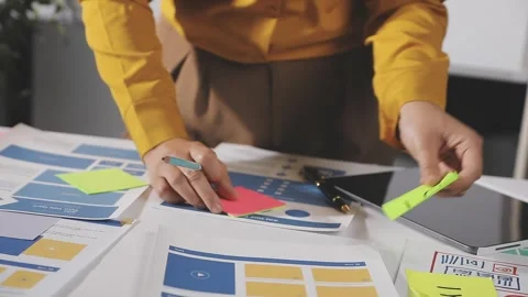 Team of UI UX web designer are working together to develop mobile responsiv.. Stock Footage 313584322