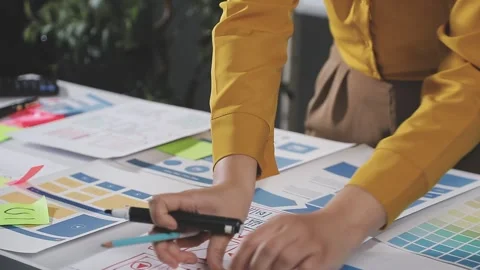 Team of UI UX web designer are working together to develop mobile responsiv.. Stock Footage 313584383