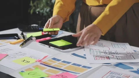 Team of UI UX web designer are working together to develop mobile responsiv.. Stock Footage 313584458