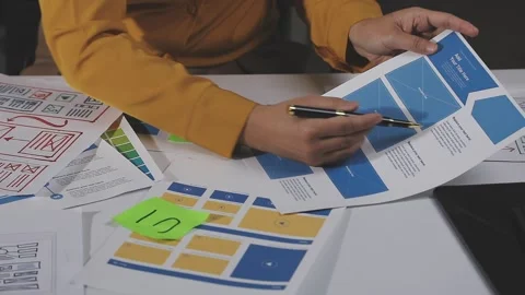 Team of UI UX web designer are working together to develop mobile responsiv.. Stock Footage 313584853