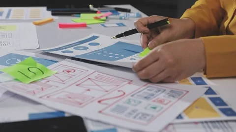 Team of UI UX web designer are working together to develop mobile responsiv.. Stock Footage 313584931