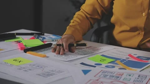 Team of UI UX web designer are working together to develop mobile responsiv.. Stock Footage 313585026