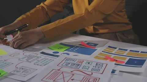Team of UI UX web designer are working together to develop mobile responsiv.. Stock Footage 313585027