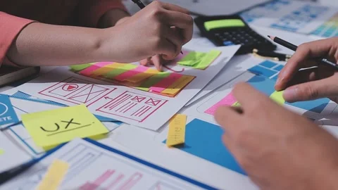 Team of UI UX web designer are working together to develop mobile responsiv.. Stock Footage 326303155