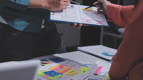 Team of UI UX web designer are working together to develop mobile responsiv.. Stock Footage 326303558