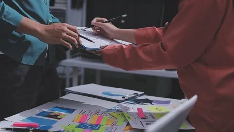 Team of UI UX web designer are working together to develop mobile responsiv.. Stock Footage 326303559