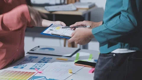 Team of UI UX web designer are working together to develop mobile responsiv.. Stock Footage 328847580