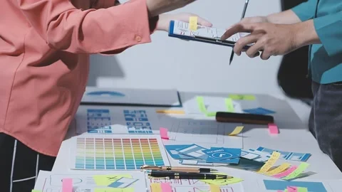 Team of UI UX web designer are working together to develop mobile responsiv.. Stock Footage 328847602