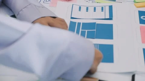 Team of UI UX web designer are working together to develop mobile responsiv.. Stock Footage 330333800