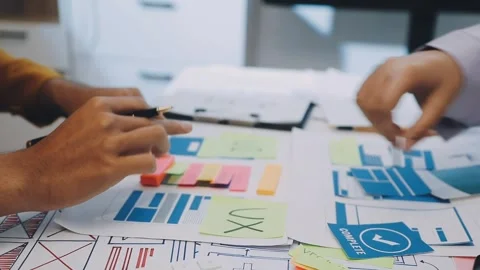 Team of UI UX web designer are working together to develop mobile responsiv.. Stock Footage 330333813