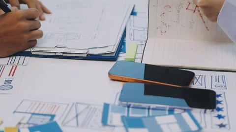 Team of UI UX web designer are working together to develop mobile responsiv.. Stock Footage 330333837