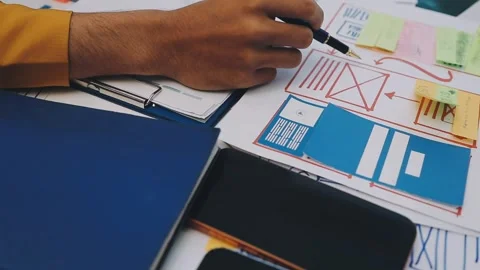 Team of UI UX web designer are working together to develop mobile responsiv.. Stock Footage 330333862