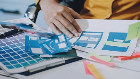 Team of UI UX web designer are working together to develop mobile responsiv.. Stock Footage 330333919