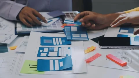 Team of UI UX web designer are working together to develop mobile responsiv.. Stock Footage 330333924