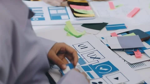 Team of UI UX web designer are working together to develop mobile responsiv.. Stock Footage 330333944