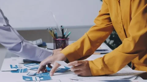 Team of UI UX web designer are working together to develop mobile responsiv.. Stock Footage 336485825